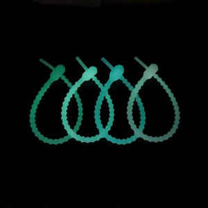 Set of 4 fluorescent green silicone cable ties with adjustable tadpole design for DIY use