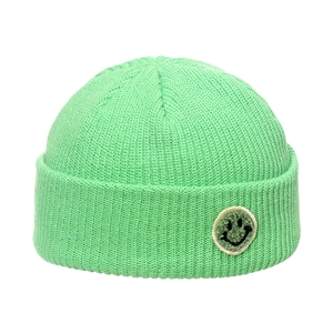 Mint green ribbed knit beanie with a smiling face patch for trendy winter warmth