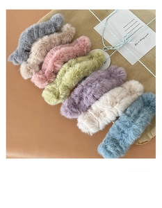 Detailed view of 7 plush faux fur hair claw clips in assorted autumn pastel colors