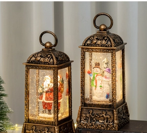 Detail of vintage Christmas lanterns with Santa and Snowman motifs and warm LED lighting