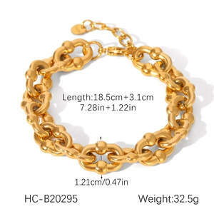 Detail view of bold 18K gold-plated chunky link bracelet with lobster clasp and adjustable chain