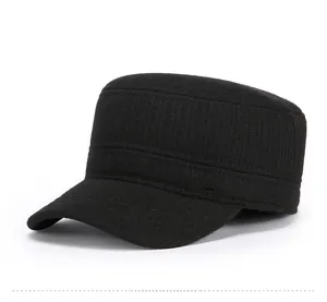 Side detail of black flat top military cap featuring a metallic China mountain badge
