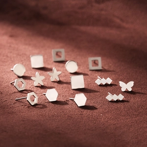 Polished geometric stainless steel earrings set featuring stars hearts and butterfly shapes