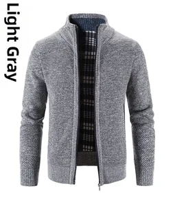 Detail of light gray knit cardigan featuring stand collar and plaid inner lining fabric