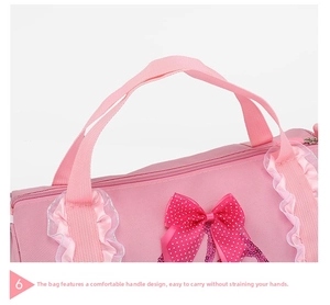 Detail of pink dance bag featuring comfortable handles, polka dot bow, and ruffle trim