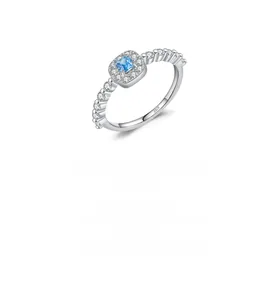 Detail of S925 sterling silver ring featuring a blue square crystal with pavé accents