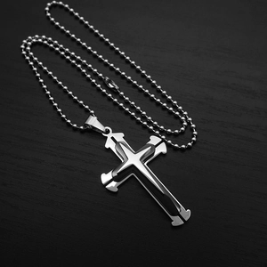 Detailed view of silver and black triple layer cross pendant on a stainless bead chain