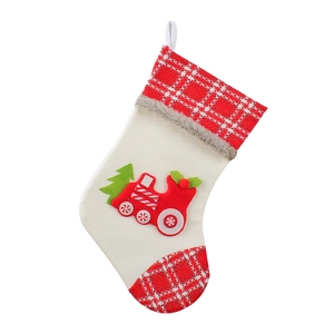Christmas train stocking with red plaid accents and white knit texture for holiday decor