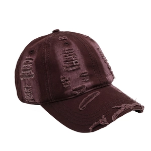 Close-up of distressed satin baseball cap in burgundy with vintage worn-out details