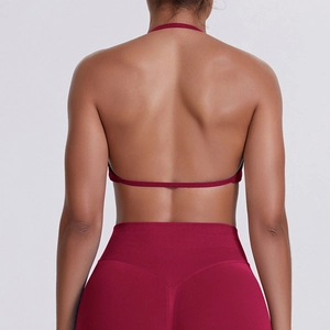 Detailed back view of dark red seamless halter neck sports bra with thin strap design
