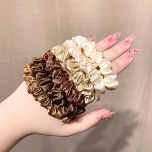 Set of 4 high elasticity satin scrunchies in earth tones for elegant ponytails