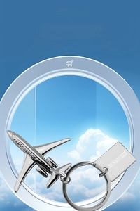 Detailed view of polished metal aircraft keychain with ring and rectangular engraved charm