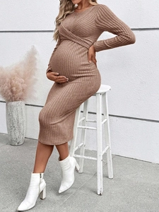 Detail of warm brown ribbed knit maternity dress showing texture and high elasticity