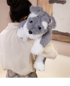 Rear view showing the large scale of this plush gray and white Schnauzer dog toy