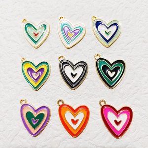 Nine colorful enamel heart pendants with gold metal frames for DIY jewelry crafts