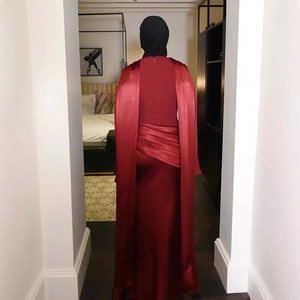 Elegant wine red satin floor-length evening gown with back pleat details and cape sleeves