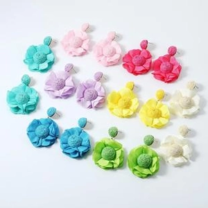 Detailed grid of oversized fabric flower earrings in eight vibrant and fashionable colors