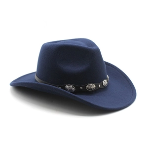 Detailed view of a navy wool felt fedora with a black leather band and silver metal studs