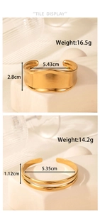 Detail view of gold crumpled texture and double-line bangles on white stone background