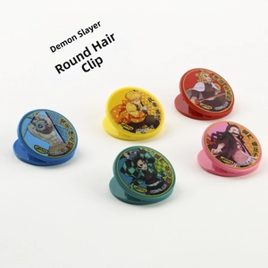 Detail view of colorful Demon Slayer character round clips with clean white background