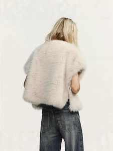 Back view of women's faux mink fur vest in cream white with a soft fluffy texture