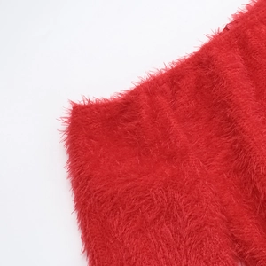 Detail view showing the bright red faux fur material and fluffy texture of the sexy dress