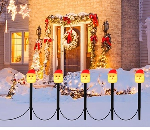 Outdoor solar Santa Claus garden stake lights with LED glow for festive snow decoration