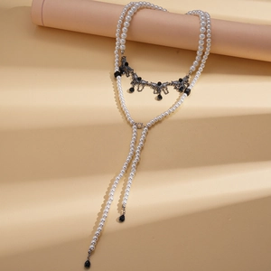 Multilayer faux pearl necklace with silver wing pendant and black teardrop tassels