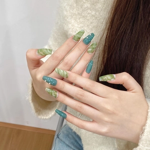 Handmade ice-transparent green marble press-on nails with gold lines and pearl accents