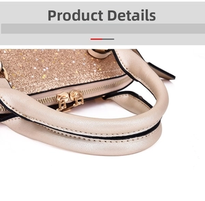 Macro shot of shimmering gold star sequins and dual metal zippers on the handbag detail