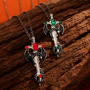 Gothic dragon swords with red and green crystals on vintage silver necklaces