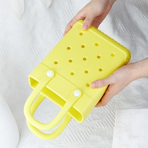 Cute yellow EVA beach tote bag with perforated holes and durable handles for summer