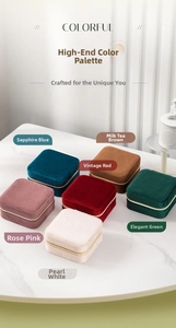 Detailed top view of six colorful velvet jewelry boxes with elegant gold metal zippers