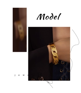 Detailed close-up of gold-plated Cuban chain bracelet featuring textured link patterns