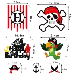 Halloween pirate party decoration set with skull banners and cake toppers on white background