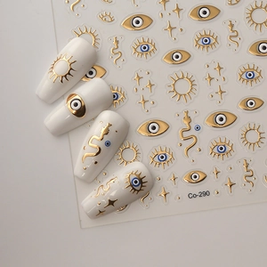 Detail of 5D embossed nail stickers featuring golden stars, snakes and evil eye motifs