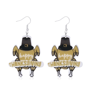Close-up of turkey earrings with Happy Thanksgiving text on white background