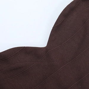 Detail of coffee brown ribbed knit fabric texture and high-quality neckline stitching