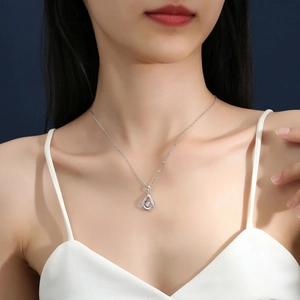 S925 sterling silver teardrop pendant necklace with a moving moissanite on model