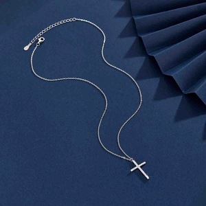 Close-up of S925 silver cross necklace with pavé zircons and adjustable chain detail