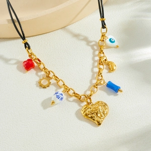Gold-plated heart and evil eye pendant necklace with black wax rope and metal chain link