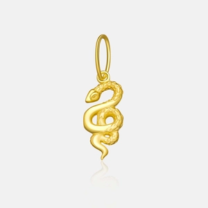 Macro detail of a gold snake-shaped pendant with realistic scale texture and metallic shine