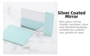 Detail of unbreakable silver-plated rectangular mirror with a mint green leather pouch