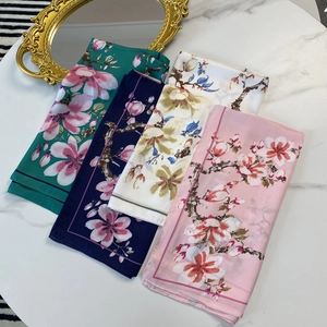 Elegant 70cm square silk scarf with floral prints in green, navy, white, and pink
