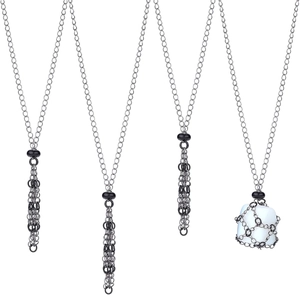 Close-up of silver metal mesh necklace pouch with white crystal stone and chain fringe