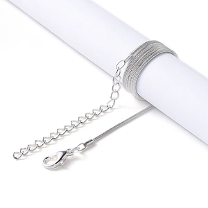 Detail of silver snake chain necklace with lobster clasp and adjustable extension link