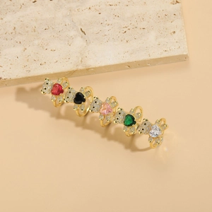 Detail of 14K gold plated rings featuring teddy bears with colorful heart zircons