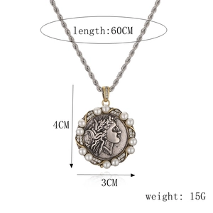 Detailed view of silver coin necklace with gold border, pearls, and size dimensions