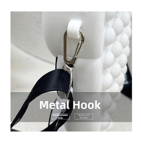 Detail of the durable metal hook and textured strap on a white silicone Pop-it bag