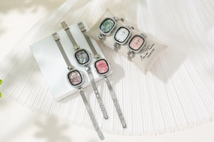 Elegant oval ladies quartz watches featuring Milanese mesh straps and sparkling crystal bezels